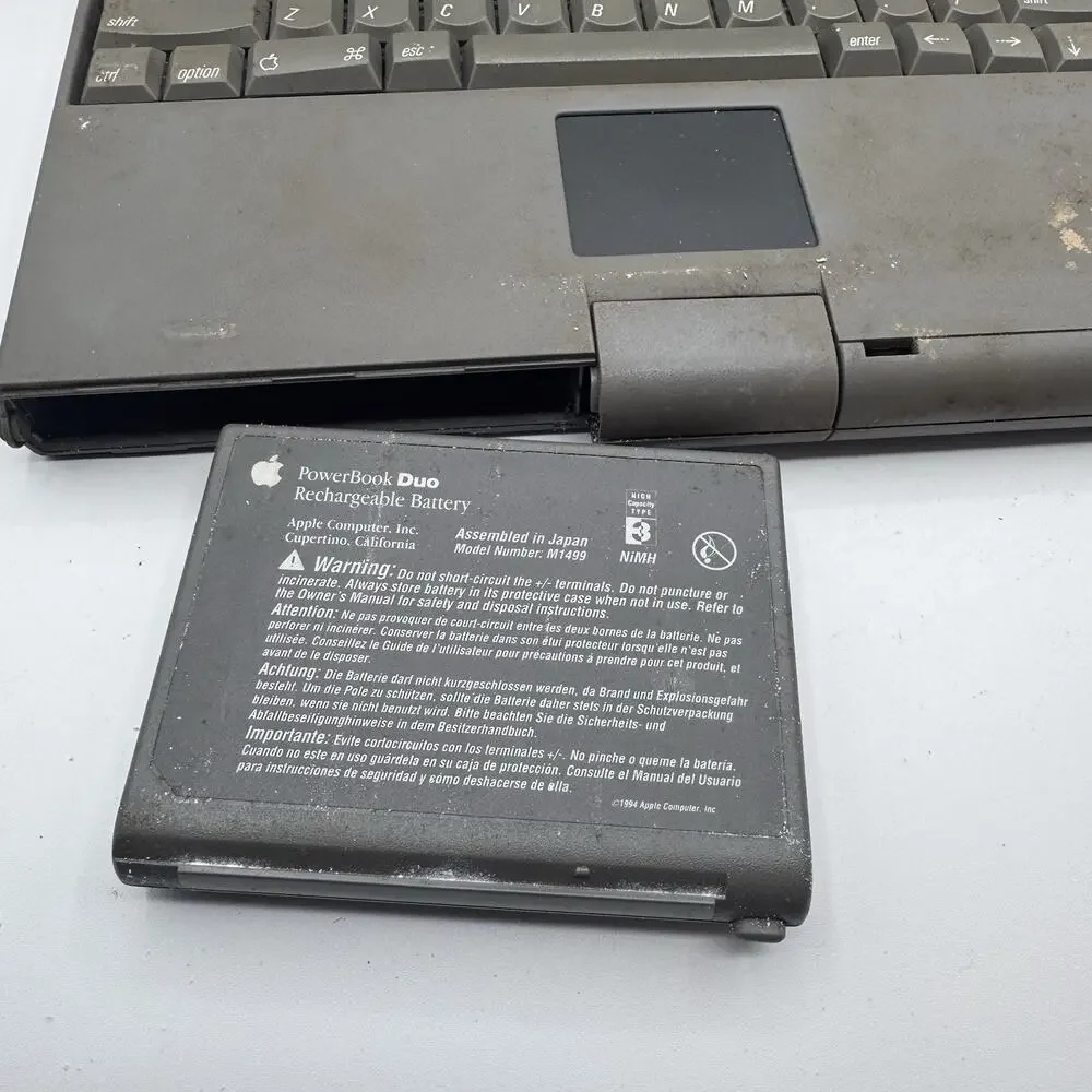 Vintage Apple Macintosh PowerBook Duo 2300c PowerPC Laptop Powers On AC Adapter